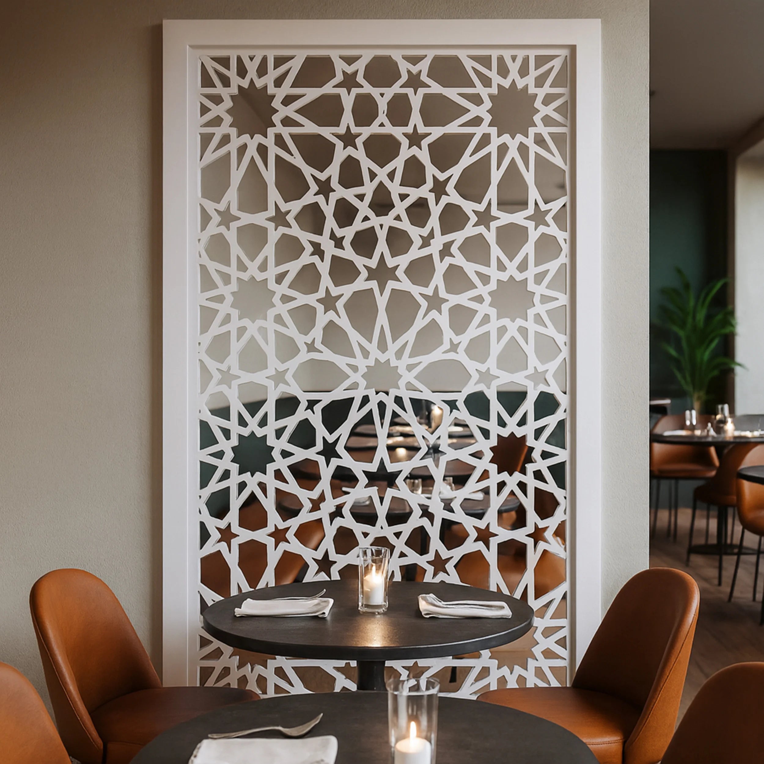 Dining area with a decorative wall panel featuring an intricate geometric pattern.